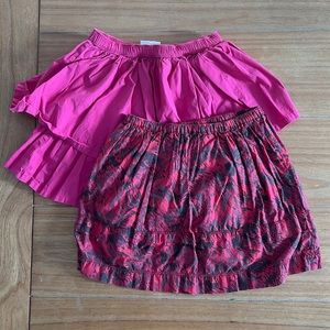 Peek Skirt, Size M (6-7), and Hanna Andersson Tiered Skirt, Size 8.